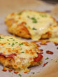 Chicken Parma served with Roast Vegetables, Broccoli, Cauliflower & Carrot with a Side of Gravy